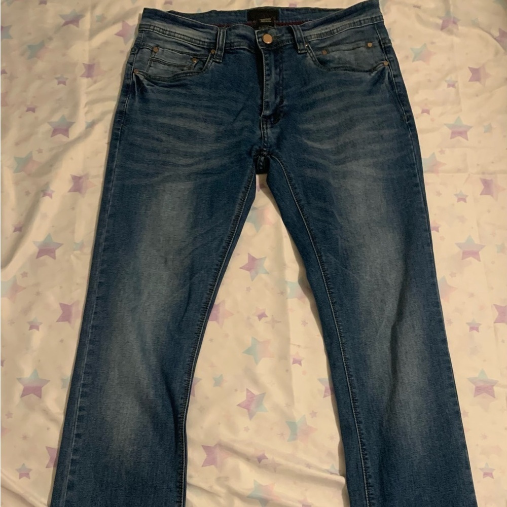 Steve's Jeans Men's stretch denim jeans in blue, size 30/32. Made in China.